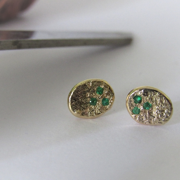 Gold earrings.
